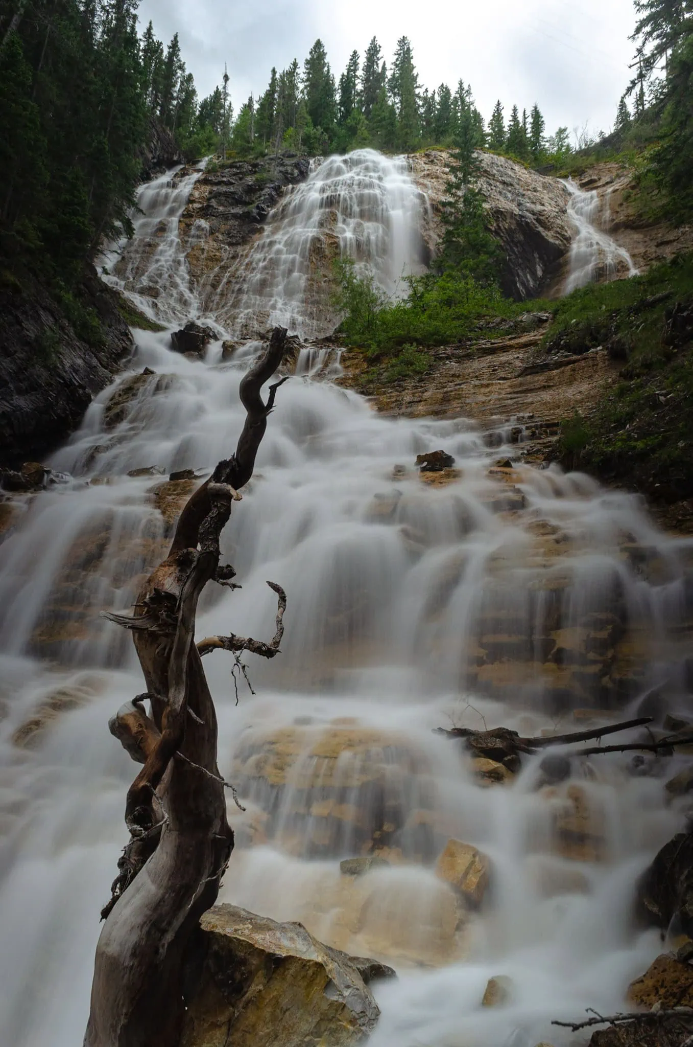 Turquoise Grassi Lakes and waterfall near Canmore