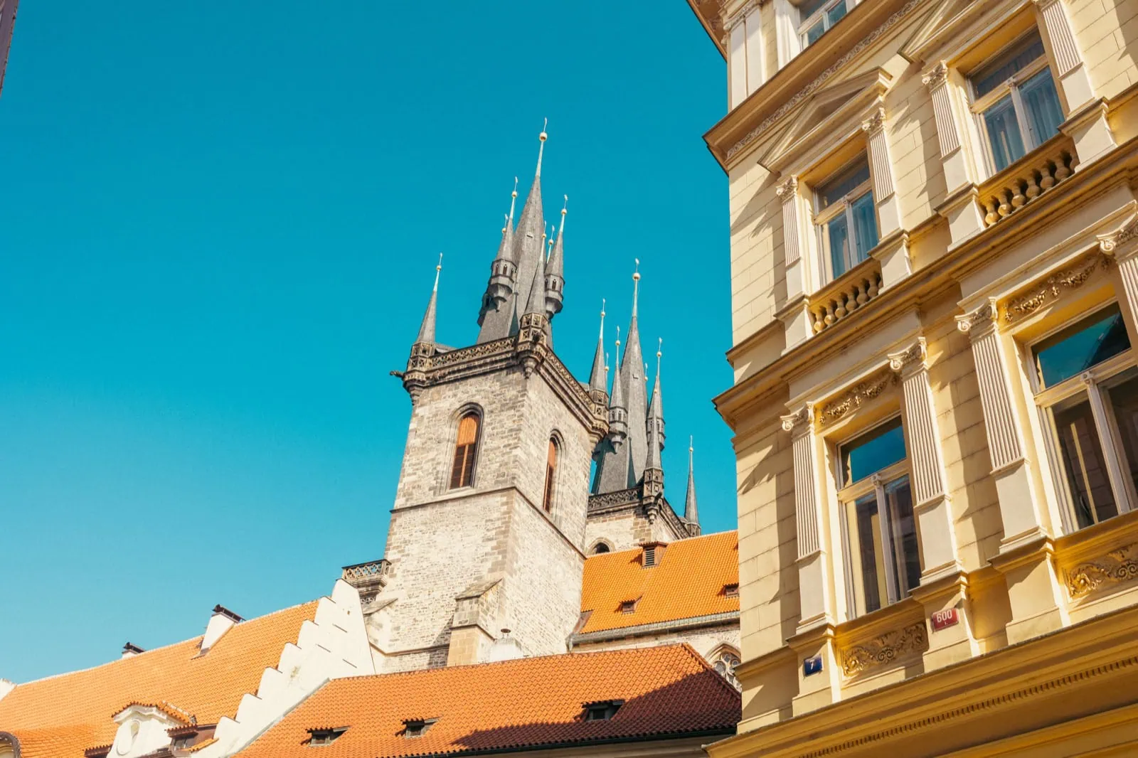 Gothic spires of the Church of Our Lady before Týn rising above the Old Town rooftops