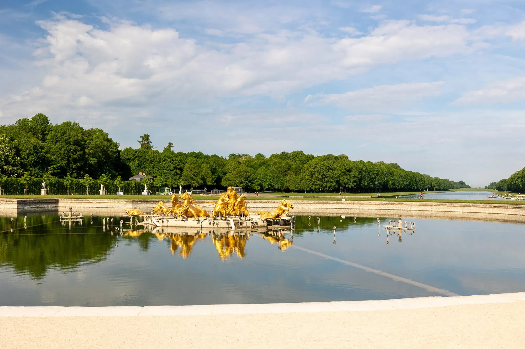 Paris in 3 Days: The Perfect Itinerary (+ 2 and 5-Day Variations) 5 Golden baroque statues reflected in the calm water of a park pond