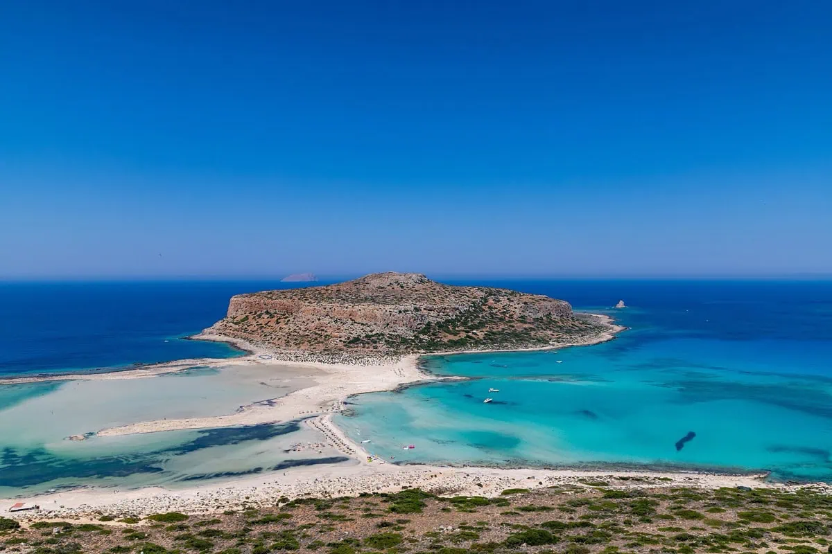 Balos lagoon in Crete seen from above, with vivid shades of turquoise and a white sandy spit