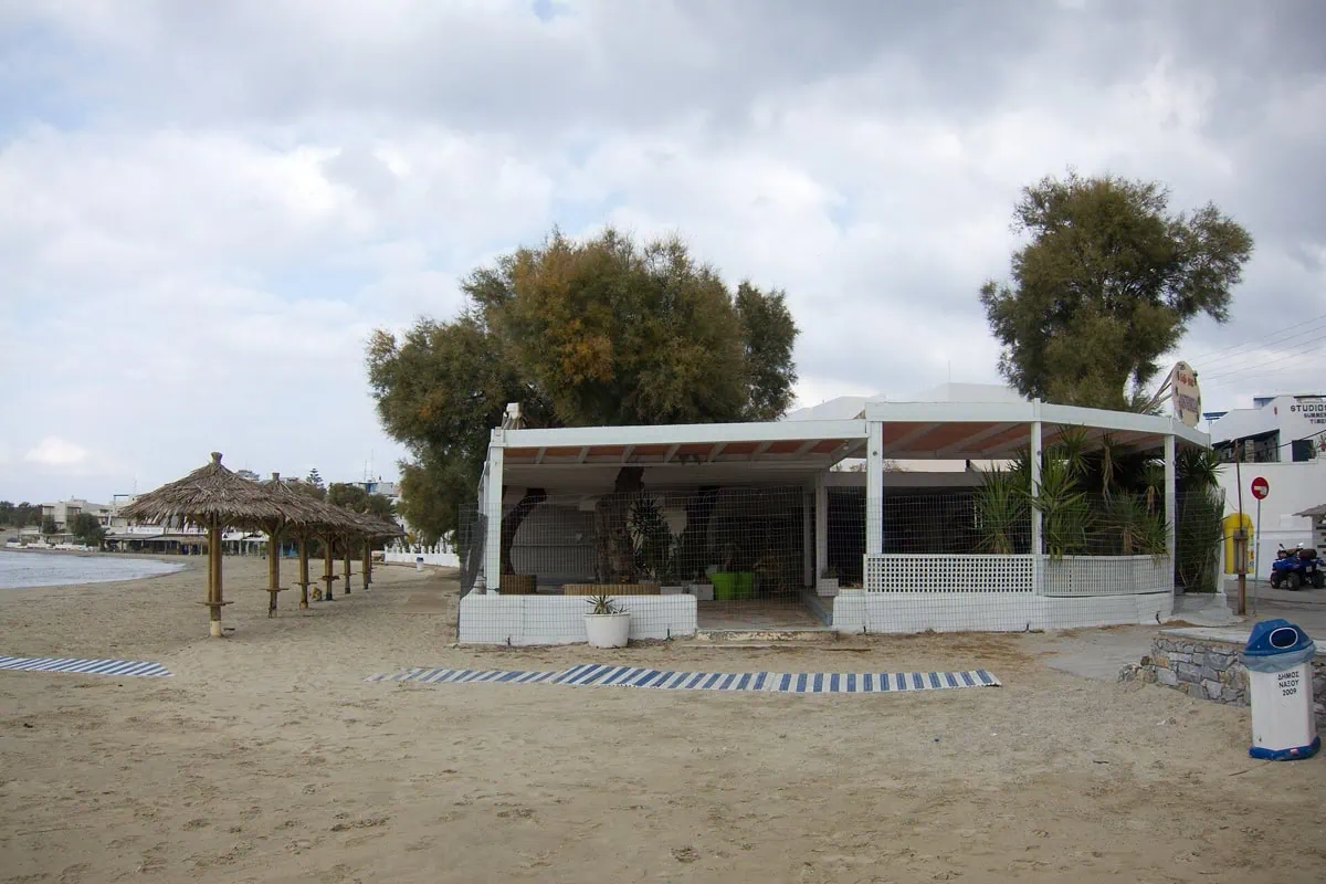 Town beach of Agios Georgios on Naxos with shallow turquoise water and wide sandy shore