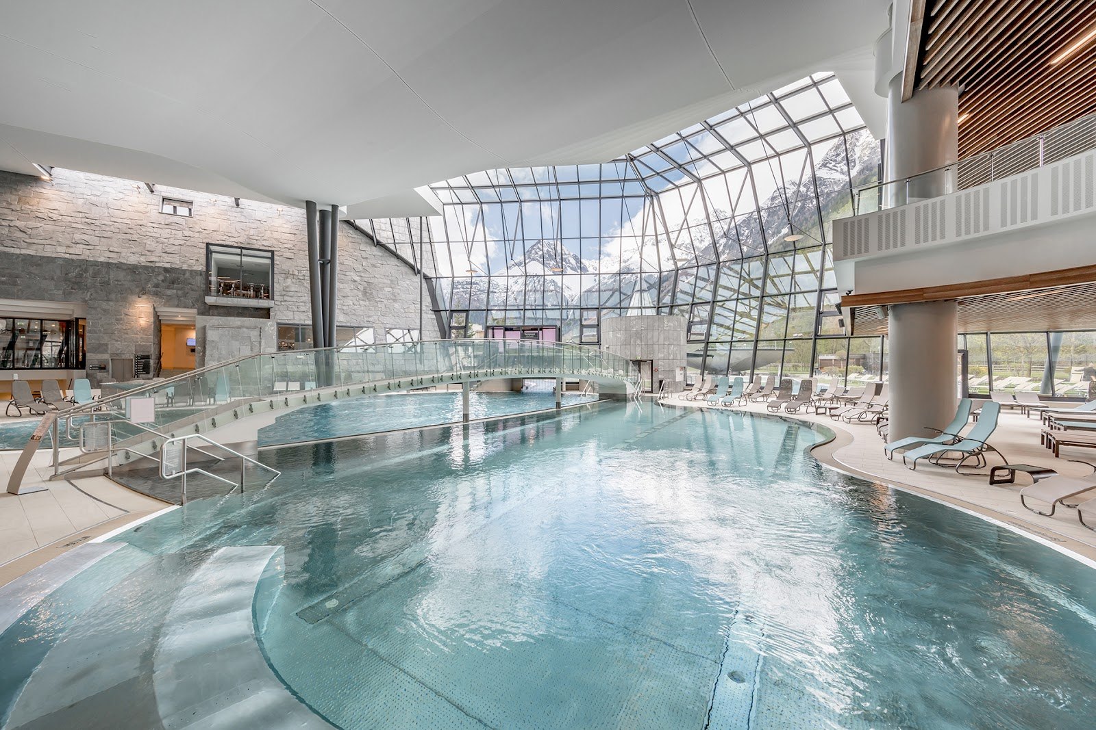 The Best Thermal Spas in Austria: 13 Spots to Visit in 2026 2 Indoor thermal pool at Aqua Dome beneath a glass roof