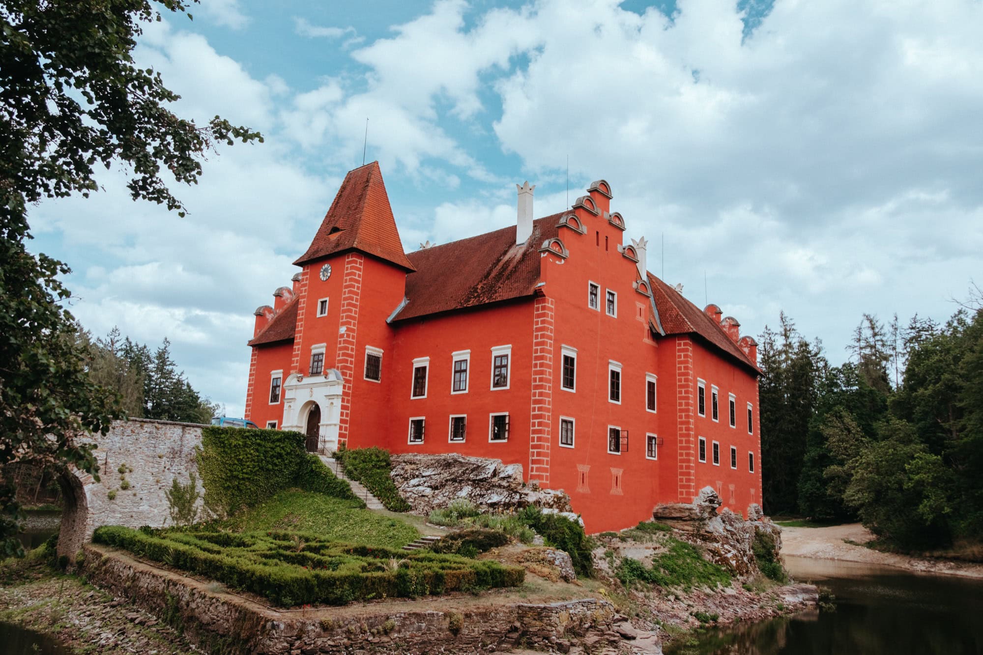 Červená Lhota Castle: 8 Tips on What to See & Know Before Visiting in 2026 76 Side view of the red Červená Lhota Castle on its rocky outcrop