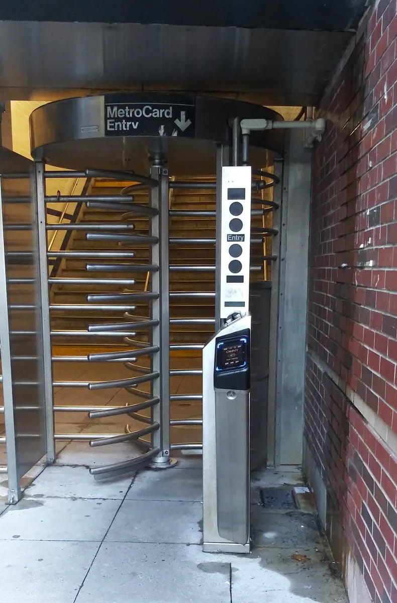 New York Transportation 2026: Subway (OMNY) and Getting From the Airport 2 A New York subway turnstile with an OMNY contactless reader