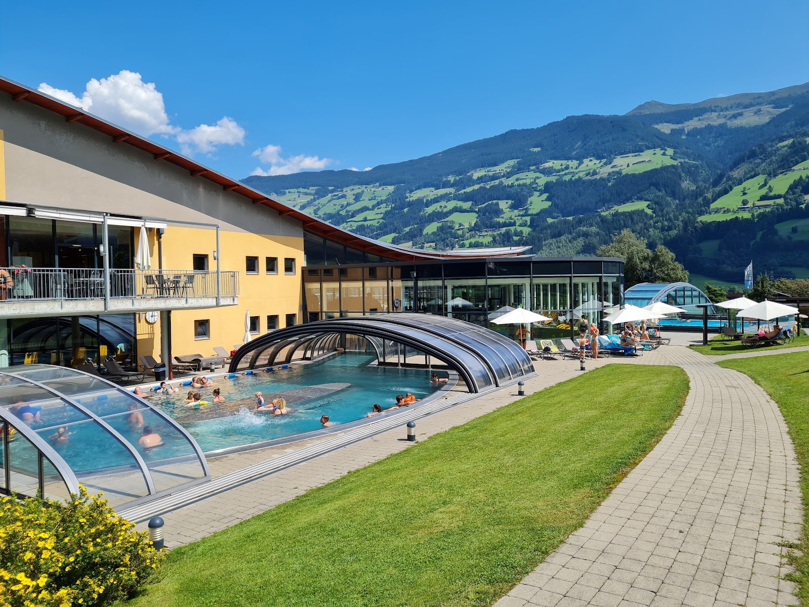 The Best Thermal Spas in Austria: 13 Spots to Visit in 2026 11 Outdoor pool at Erlebnistherme Zillertal with views of alpine peaks