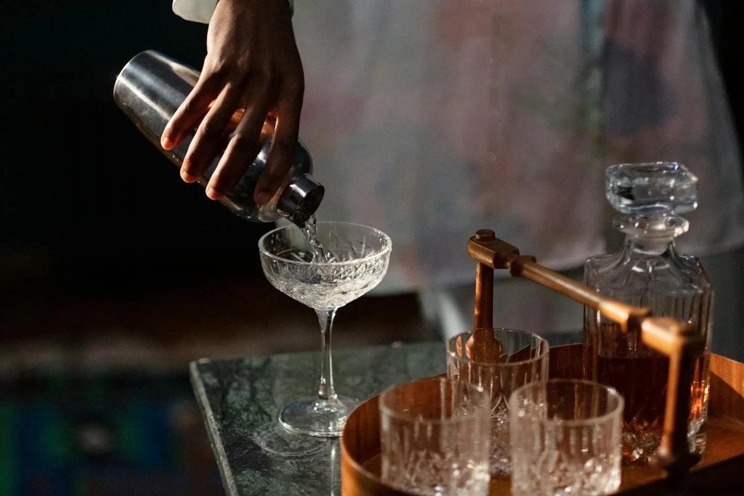 New York Nightlife: 20 Best Rooftop Bars, Clubs & Jazz 2026 4 Bartender pouring a cocktail in a stylish bar