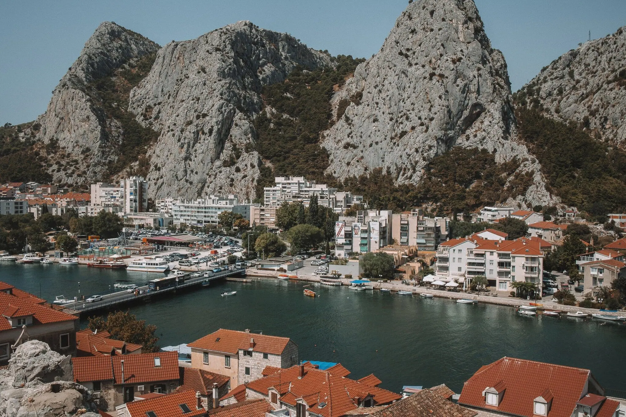 Split, Croatia: 15 Best Things to See and Do in 2026 18 Omiš beneath dramatic limestone cliffs with a harbour