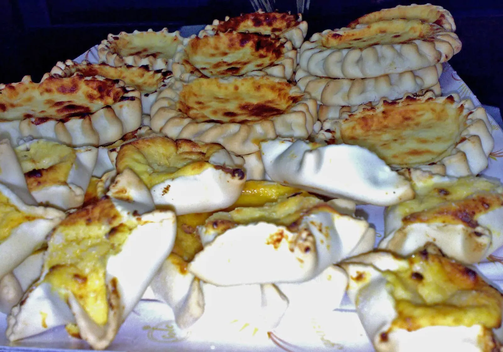 Sardinian Food: 12 Specialities You Must Try in 2026 13 Sardinian Easter pardulas baskets with ricotta