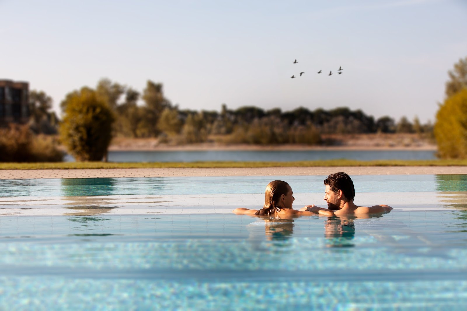 The Best Thermal Spas in Austria: 13 Spots to Visit in 2026 9 Pool at St. Martins Therme blending into nature near Lake Neusiedl