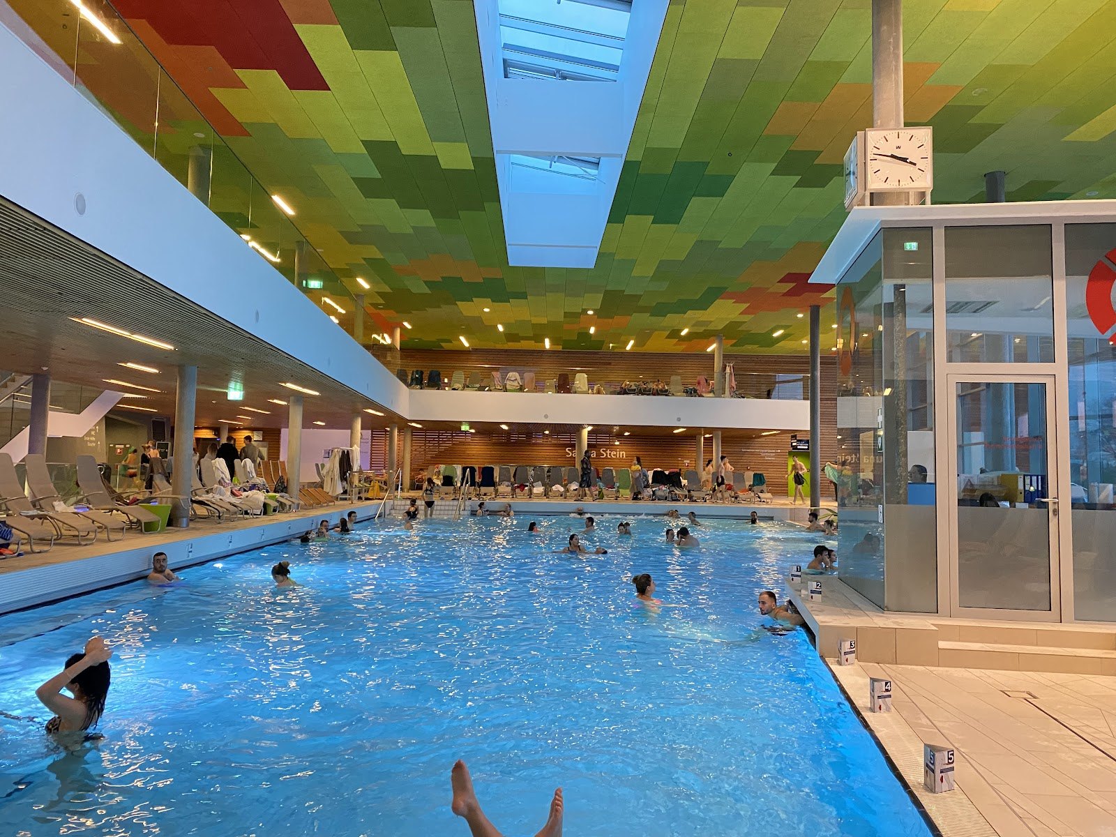 The Best Thermal Spas in Austria: 13 Spots to Visit in 2026 3 Indoor thermal pool at Therme Wien with a colourful ceiling