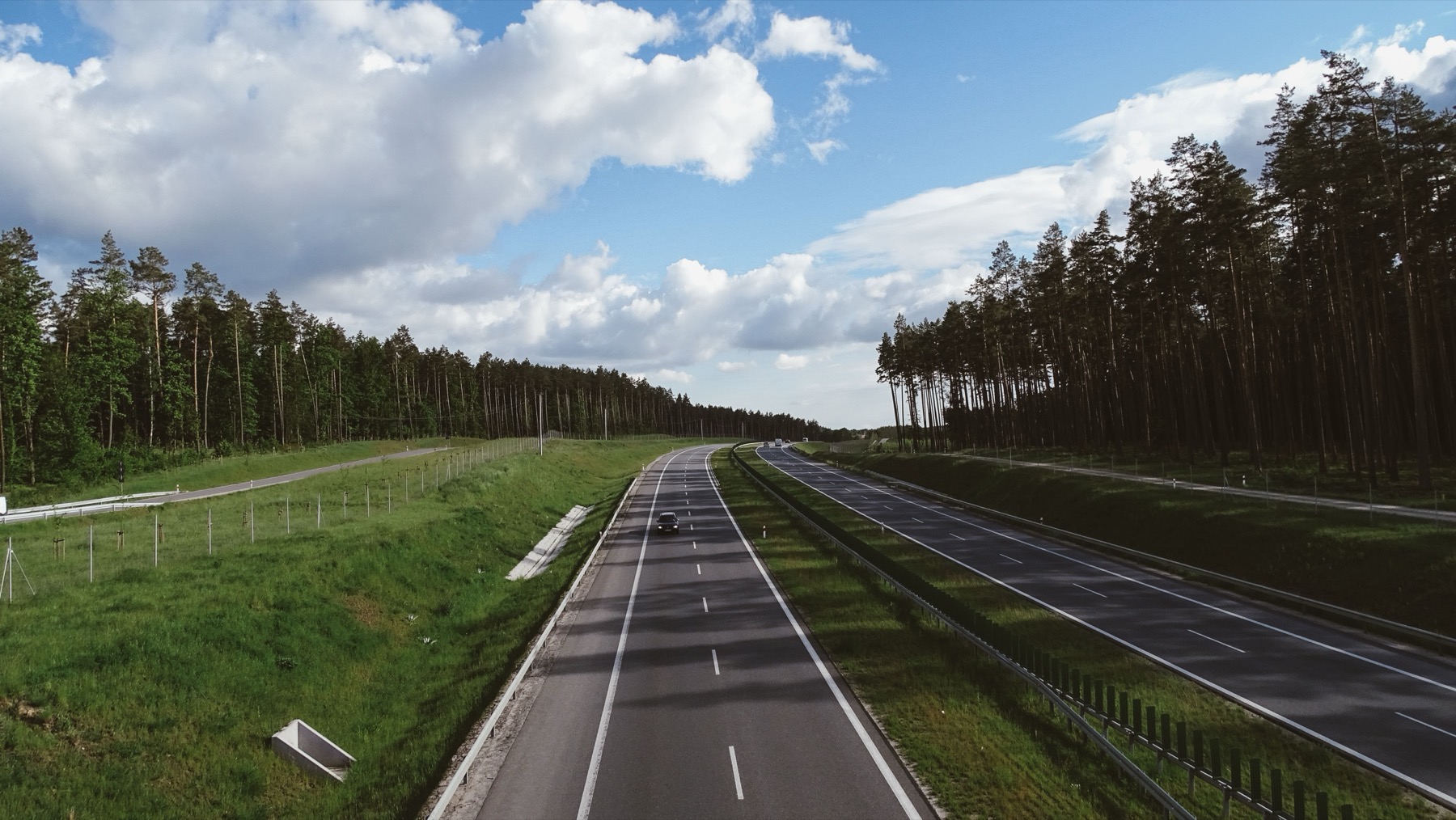 How to Travel to Estonia: Flights, Ferry & Driving in 2026 7 Road running through the Baltics