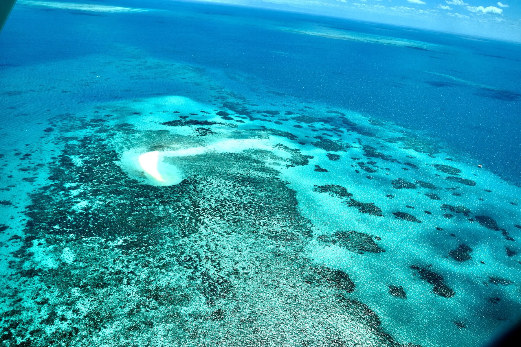 Where to Stay on the Great Barrier Reef in 2026: 12 Islands 1 Coral reefs from a bird's-eye view