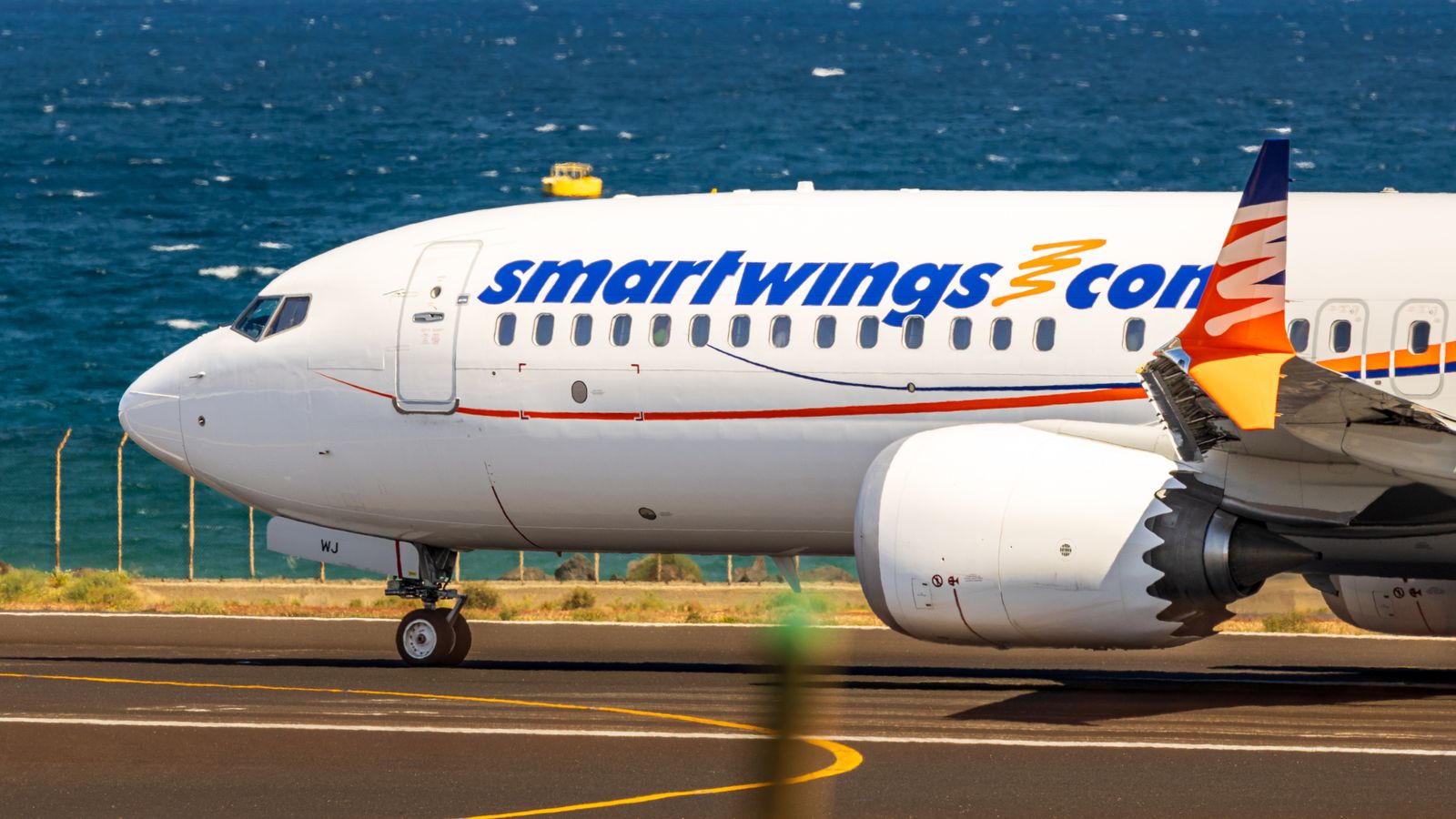 How to Get to Barcelona, Spain: Flights, Prices & Train 2026 8 Smartwings plane on the airport apron