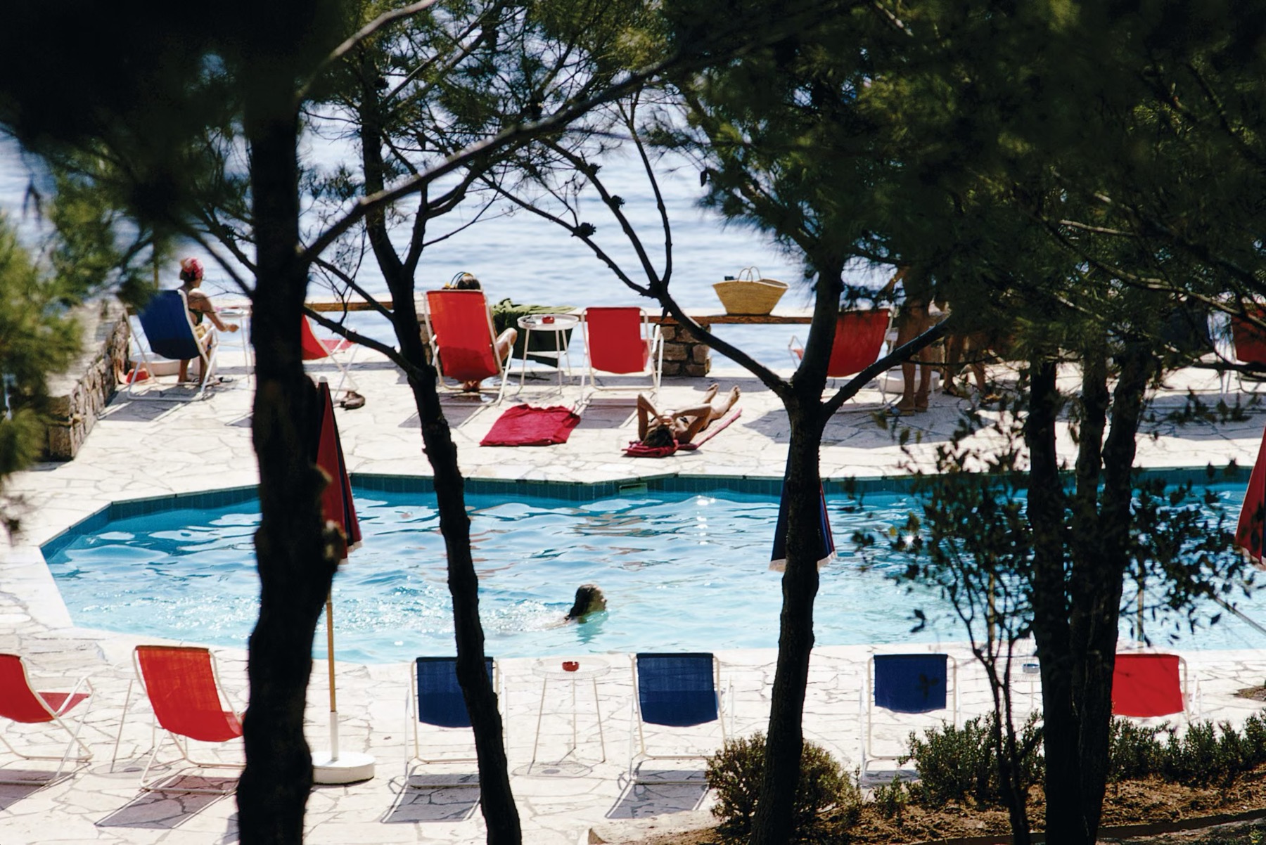 The World's Most Luxurious Hotels: 29 Addresses That Will Surprise You in 2026 1 Pool at Hotel Il Pellicano with its legendary red-and-blue loungers above the Tyrrhenian Sea