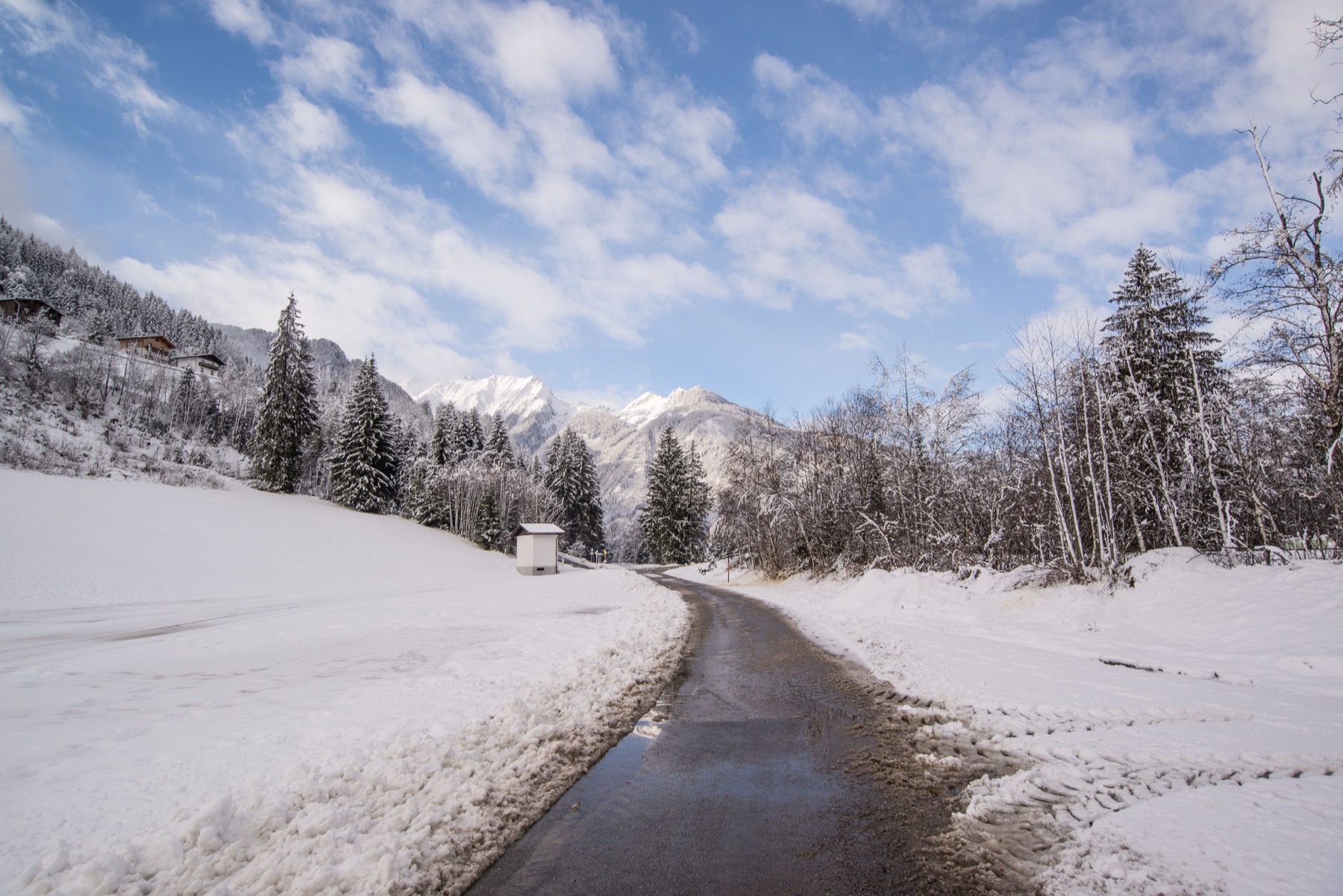 Austria Vignette 2026: Price, Where to Buy & the End of Sticker Vignettes 13 Snowy alpine road on the way to a ski resort