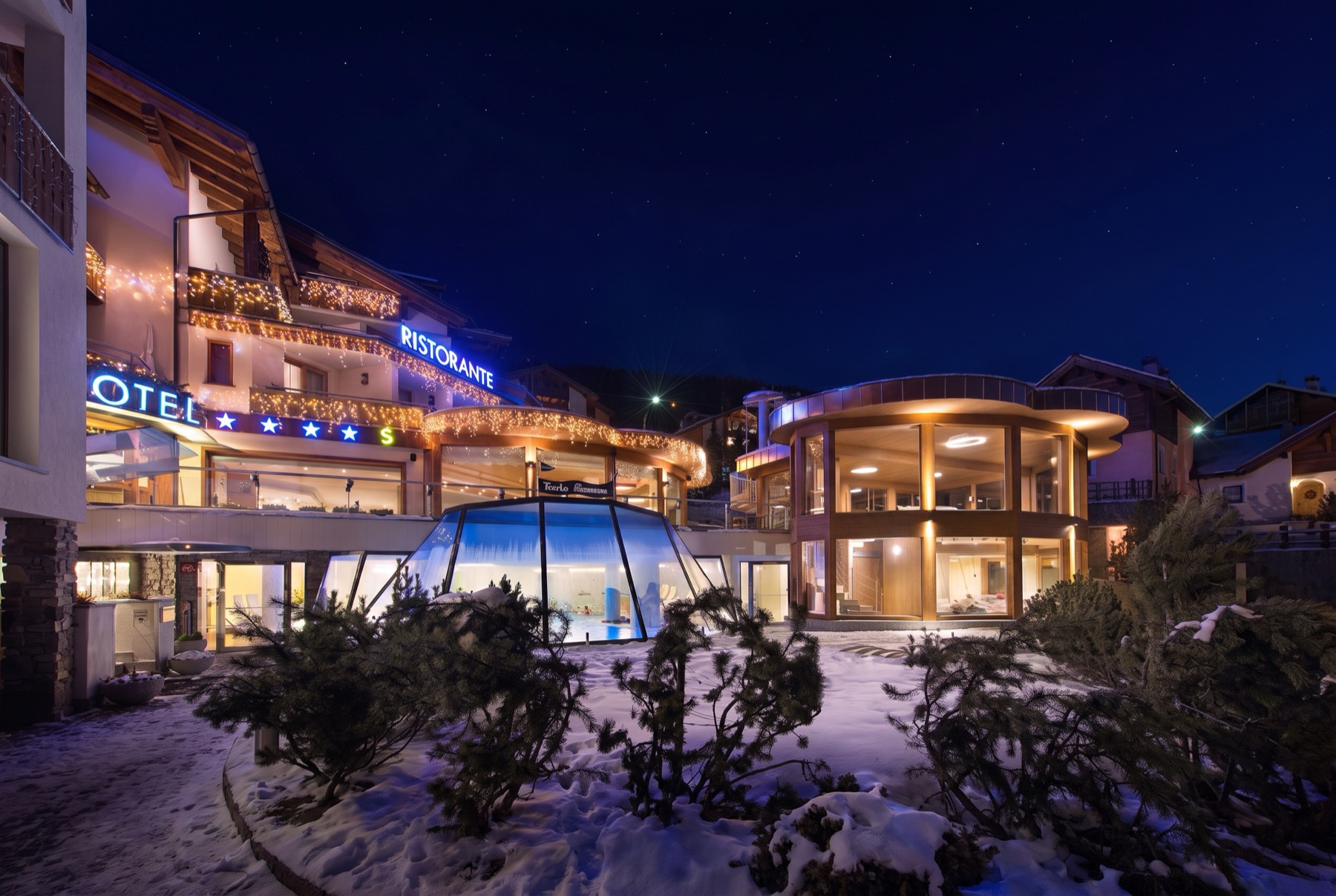 Skiing in Italy 2026: 14 Tips for the Dolomites, Livigno & Superski 3 Mountain hotel in Livigno at dusk